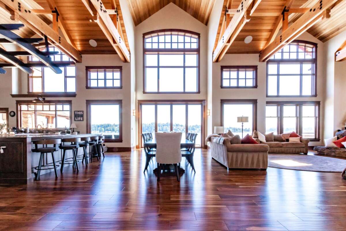 large open living room with vast windows wood ceiling