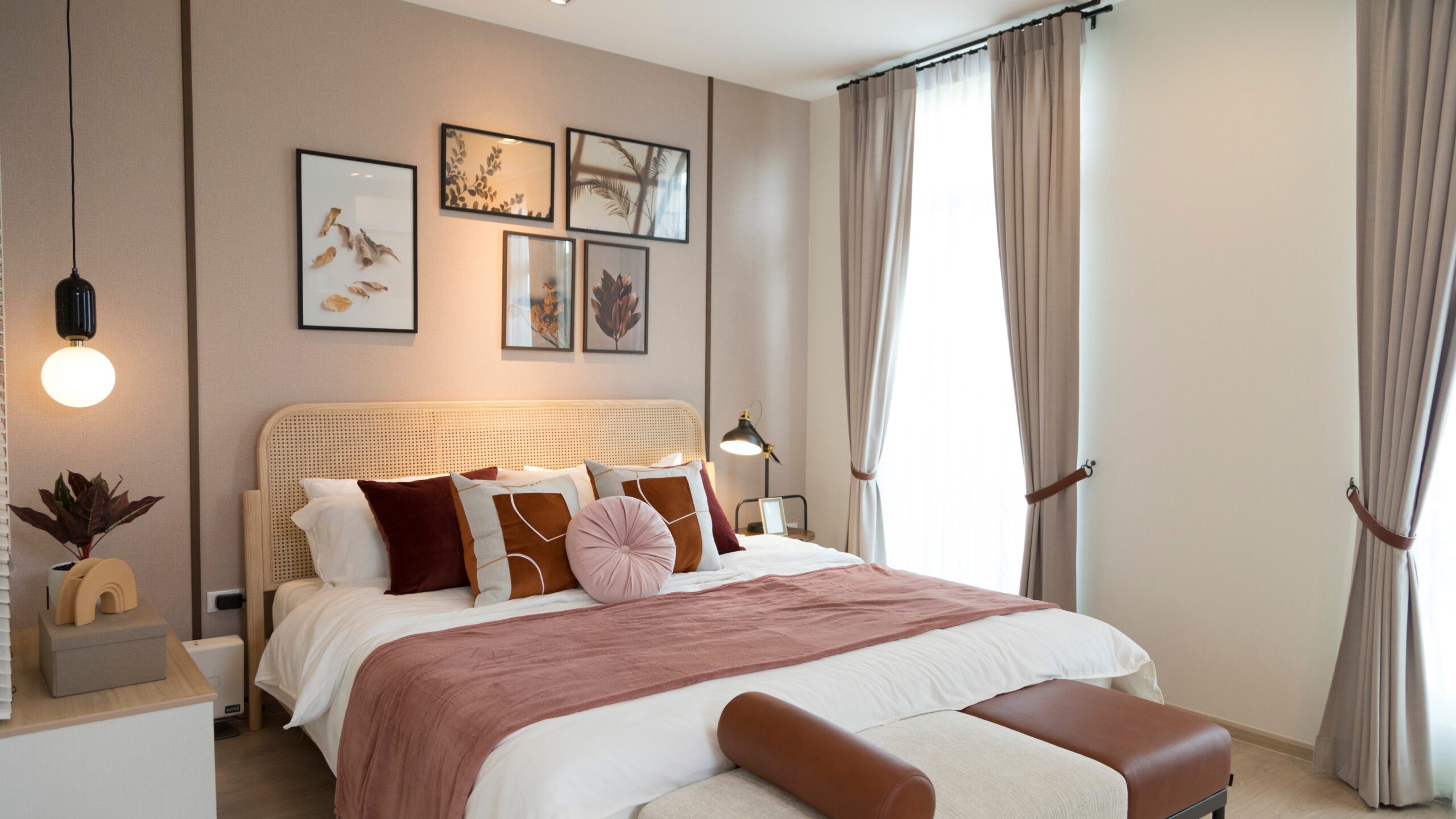 Bedroom with red-brown decor and tan paint