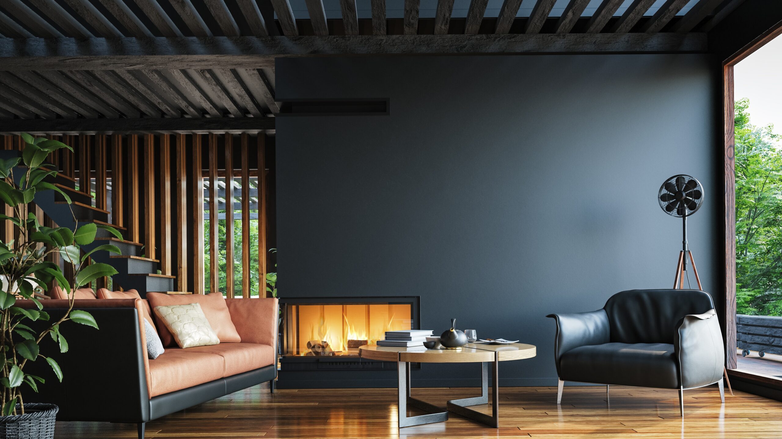 Living room with black interior, hardwood floors, small coffee table, and a fireplace