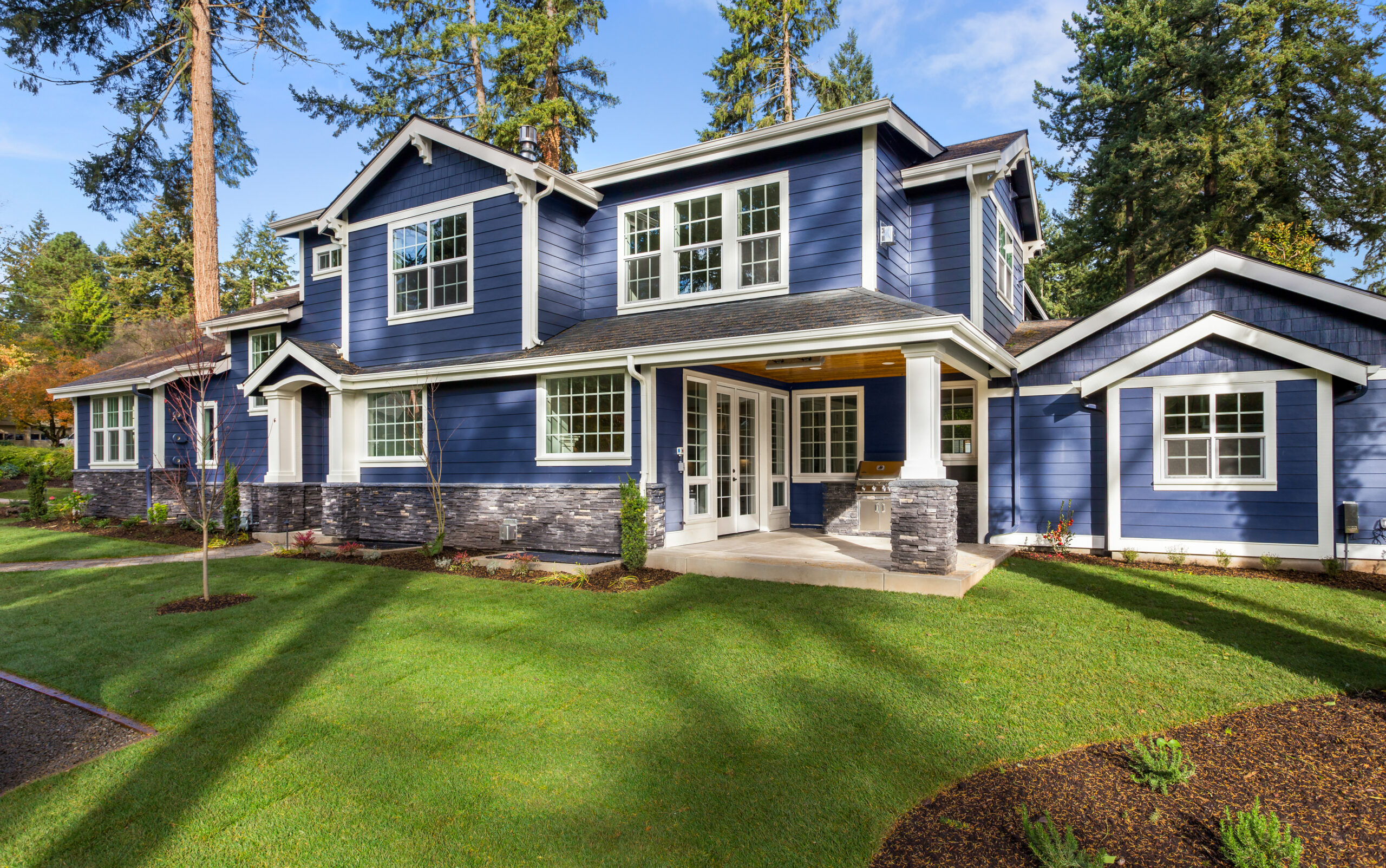 Blue house with white window and door frames
