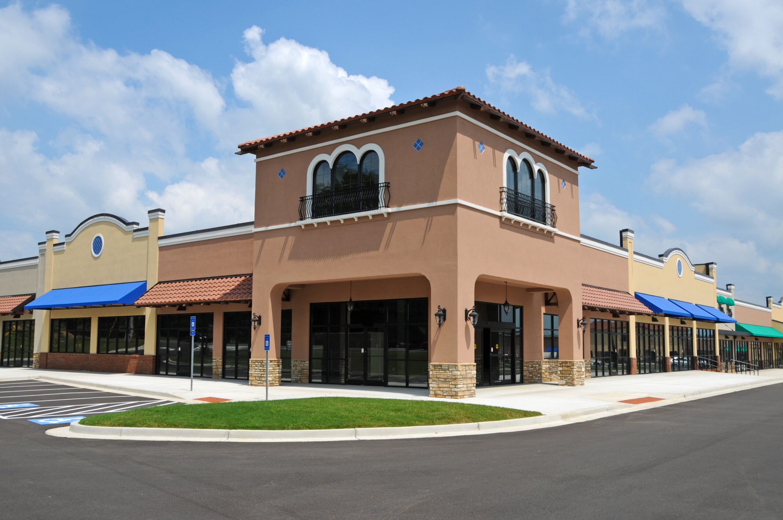 Outdoor shopping mall with blue and tile awnings