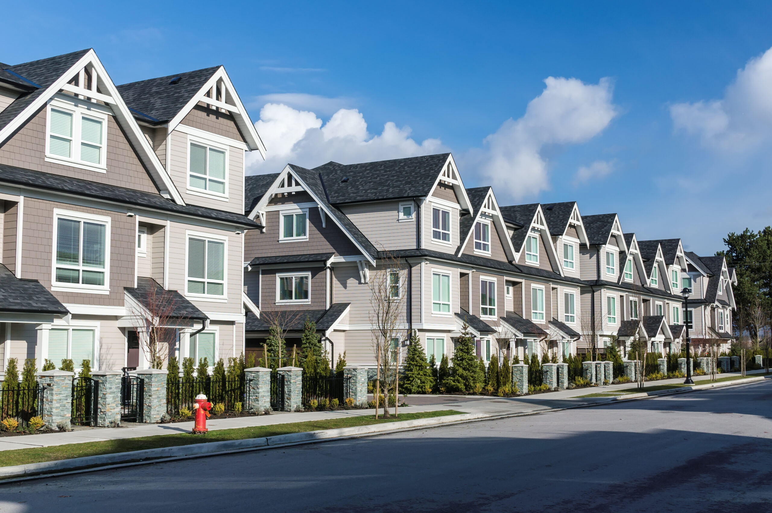 A row of three-story townhouses