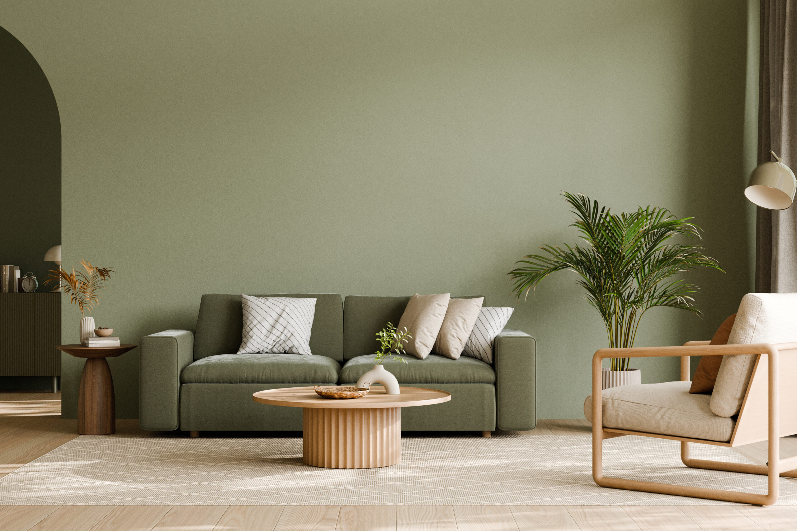 Living room with couch, chair, lamp, and plants