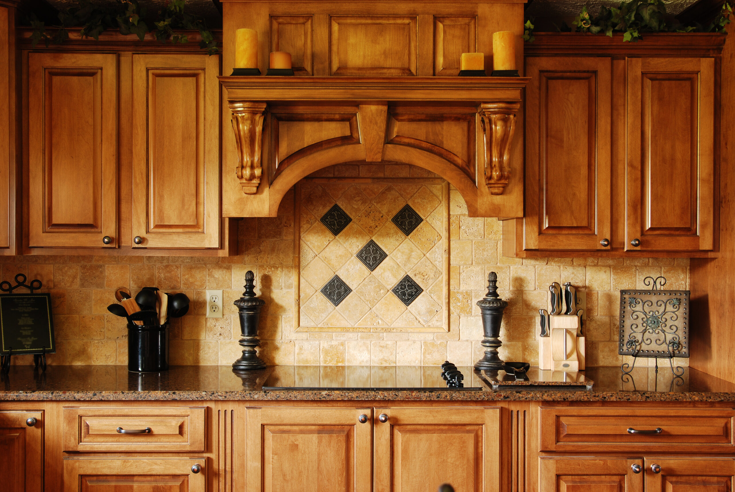 Close up of wood cabinets around a stove