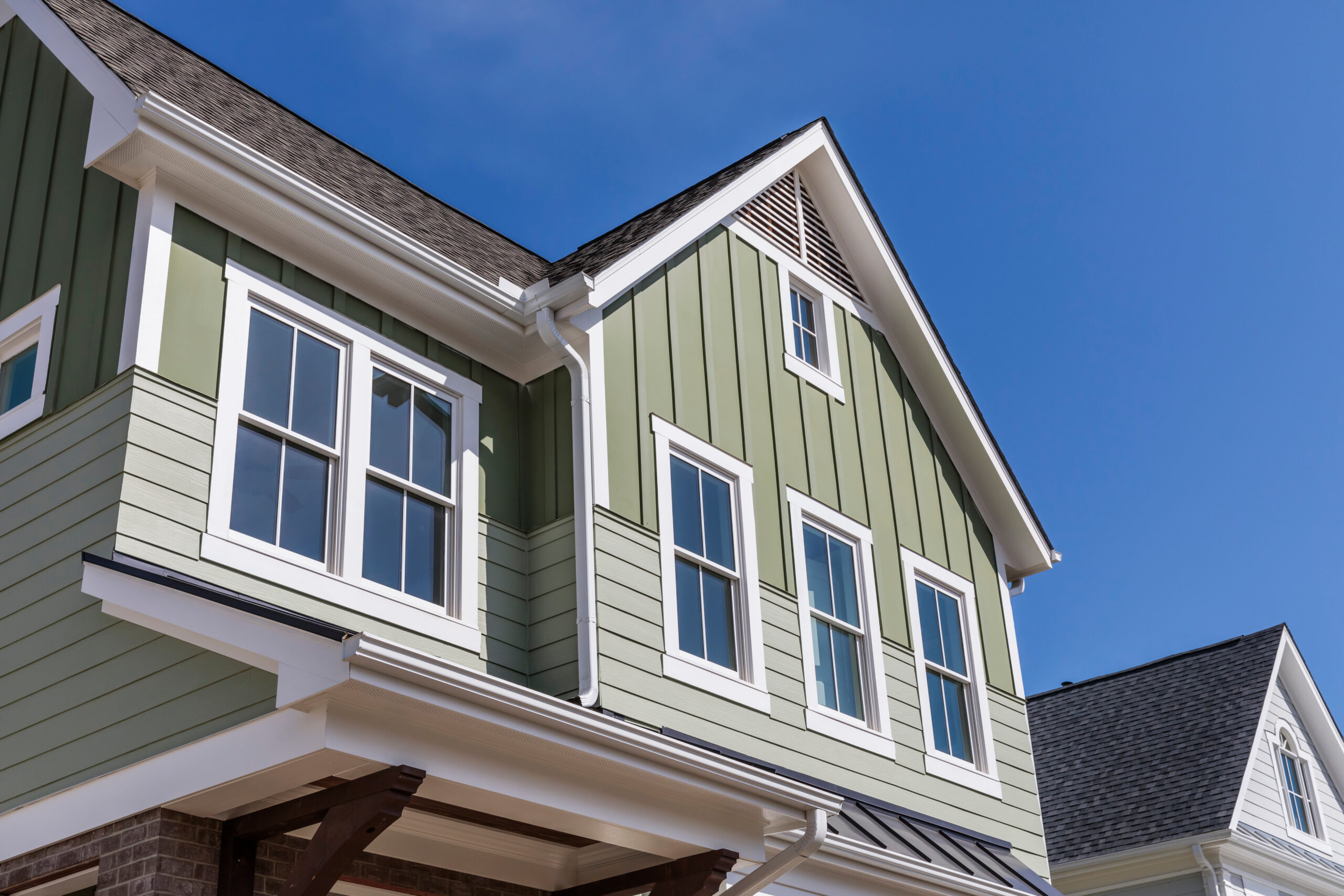 Close up of beige two-story house