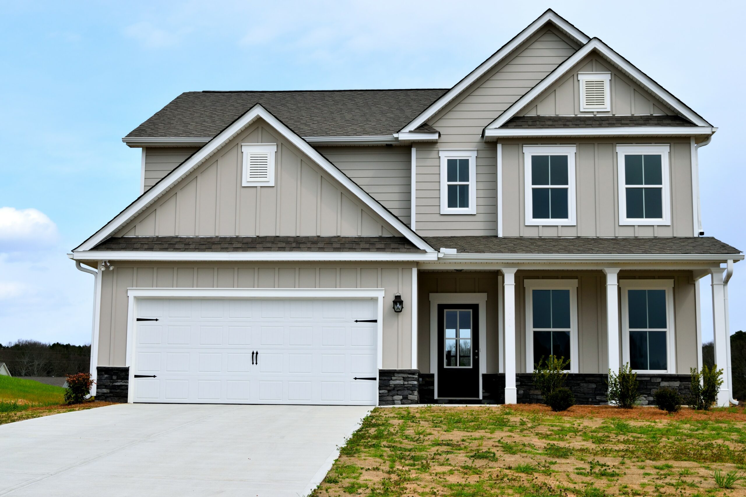 Quality exterior painting adds value and charm to tan and gray home